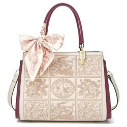 This is an off-white decorative handbag.