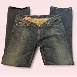 blue bootcut jeans with design on back