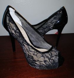 Beautiful black high heel lace high Guess shoes size 6.5