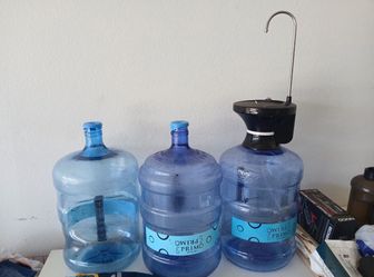 All yours for 25  water dispenser & 3 jugs
