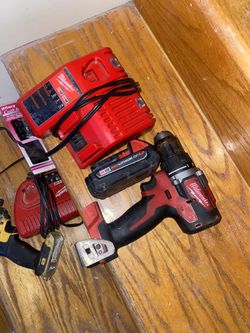 milwaukee drill, battery and charger