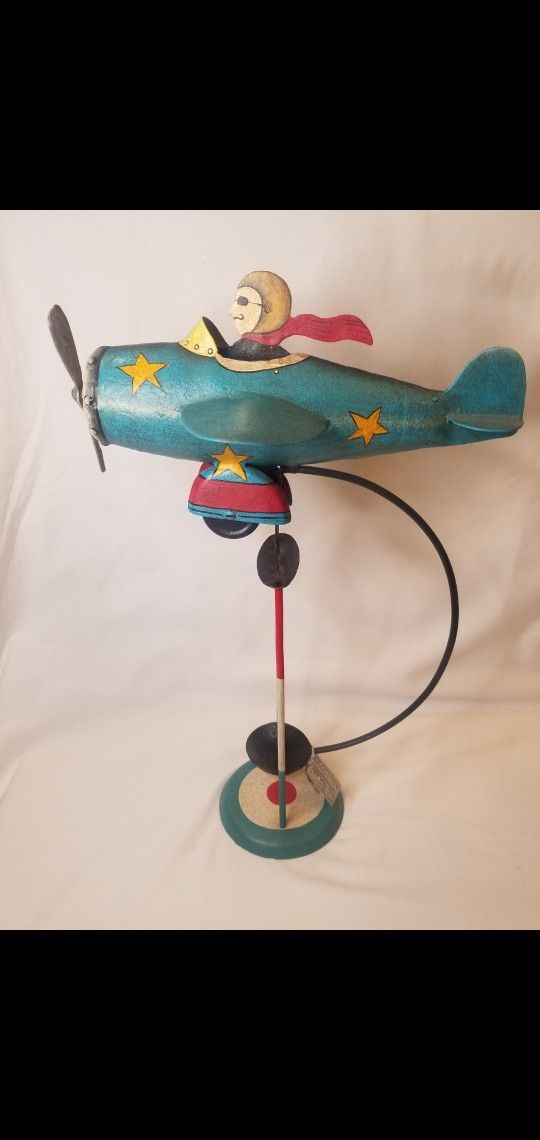 1(contact info removed) Cast Iron WW2 Flotting Pendulum Airplane & Pilot.