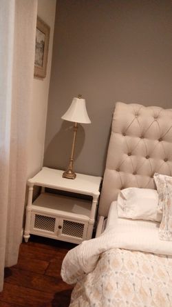 Pair of bedside lamps. Goldish Iron frame with off white shade. Lovely and works perfect.