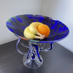 a decorative blue glass fruit bowl
