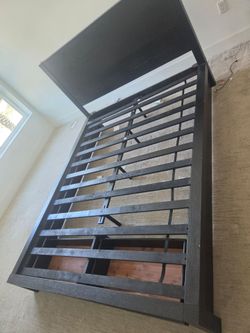 Sturdy black queen bed frame with night stands