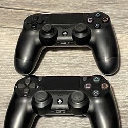 2 Sony PlayStation 4 DualShock 4 controllers 