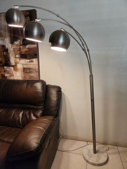 3-light arc floor lamp with metal shades and a marble base