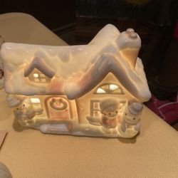 Precious moments light up cottage featuring a little boy a little girl and a snowman