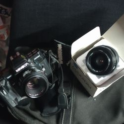 Black Minolta Camera With Extra Lens