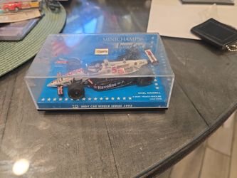 Minichamps (contact info removed)05 1993 IndyCar #5 Nigel Mansell Haas Newman Lola Ford 1:43