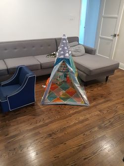 Go Gaga Teepee Gym, a multi-functional play mat designed for infants and toddlers. 