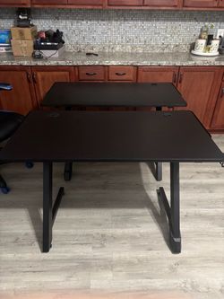 gaming chair and 2 desks