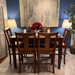 Nice Solid and Sturdy Height Dining Set in Good Condition! Table with Leaf and 6 Chairs!Table has Some marks. 