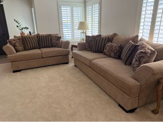 Brown sofa and loveseat