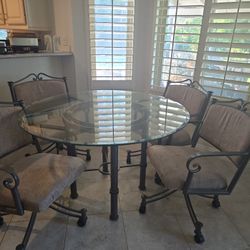 Dining Rm Set With 4 rolling chairs .