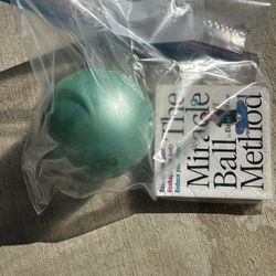 This is a Home Ipanema dinner plate with a palm leaf design and turquoise rim