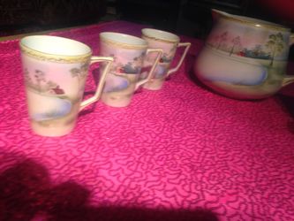 Antique Japanese pitch and 6 cups.