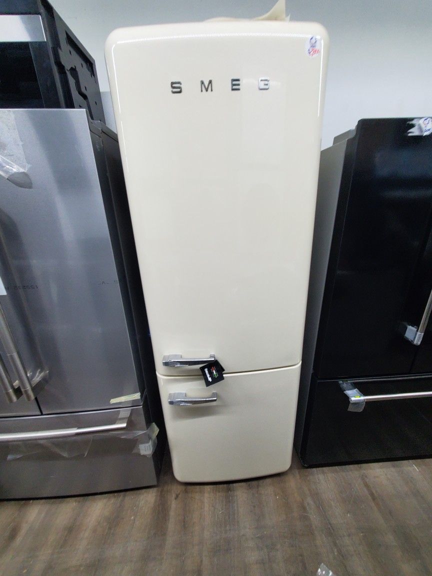 smeg fridge new open box..28 inches wide 73 hight..$2350