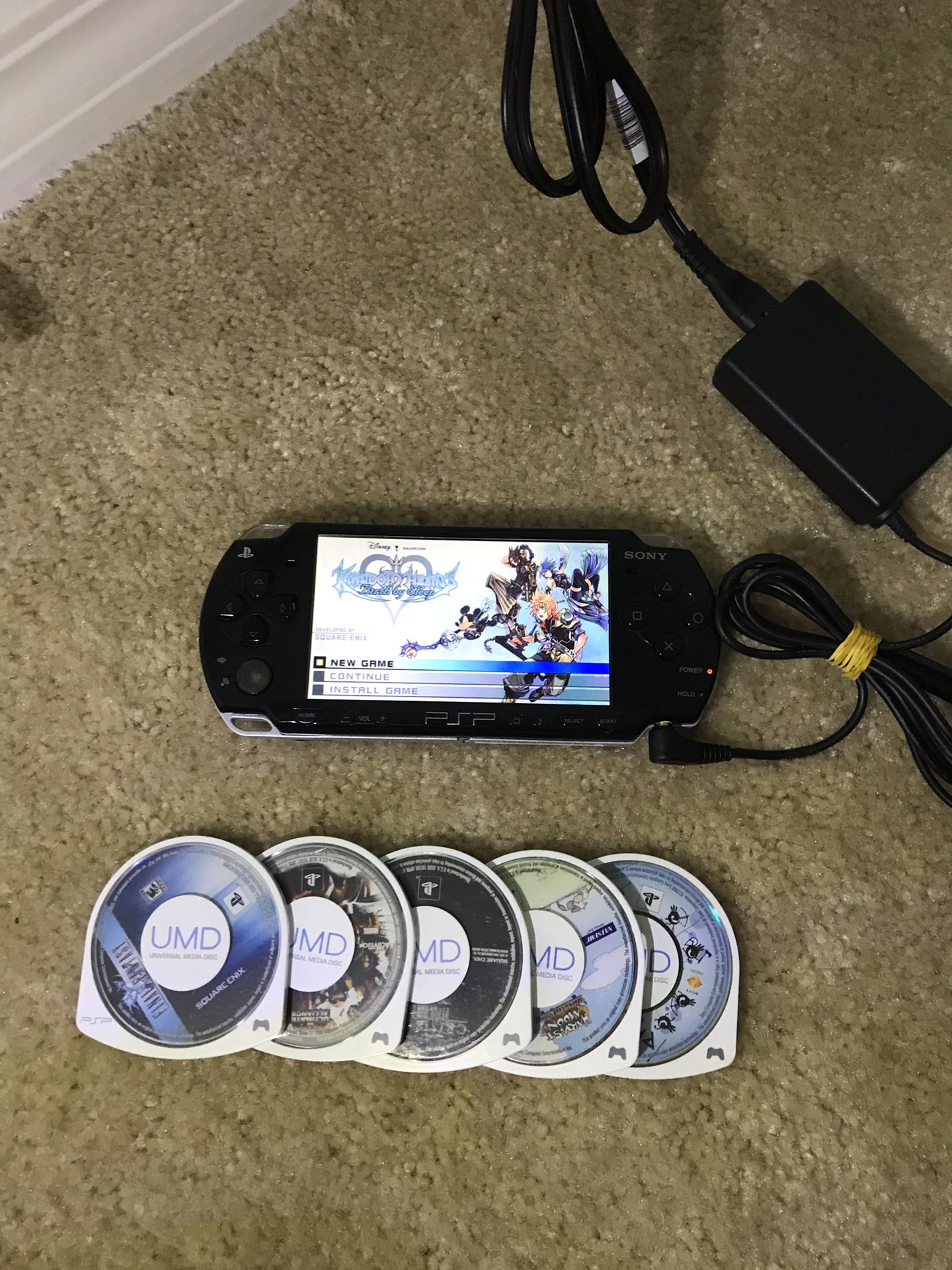 Sony PSP + Kingdom Hearts + charger + 5 games