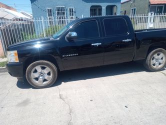 2009 Chevy Silverado four-door crew cab runs good nice rims tires $6,000 or best offer