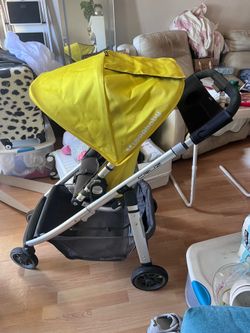 Selling a used UPPAbaby CRUZ stroller in yellow.