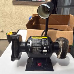 Bench grinder with lamp