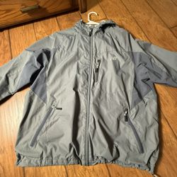 Men’s  gray New Balance hooded windbreaker jacket featuring a chest pocket and branded logo XL on tag  Flaws as seen in the last picture