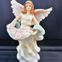 Angel Holding Roses On A Cloud