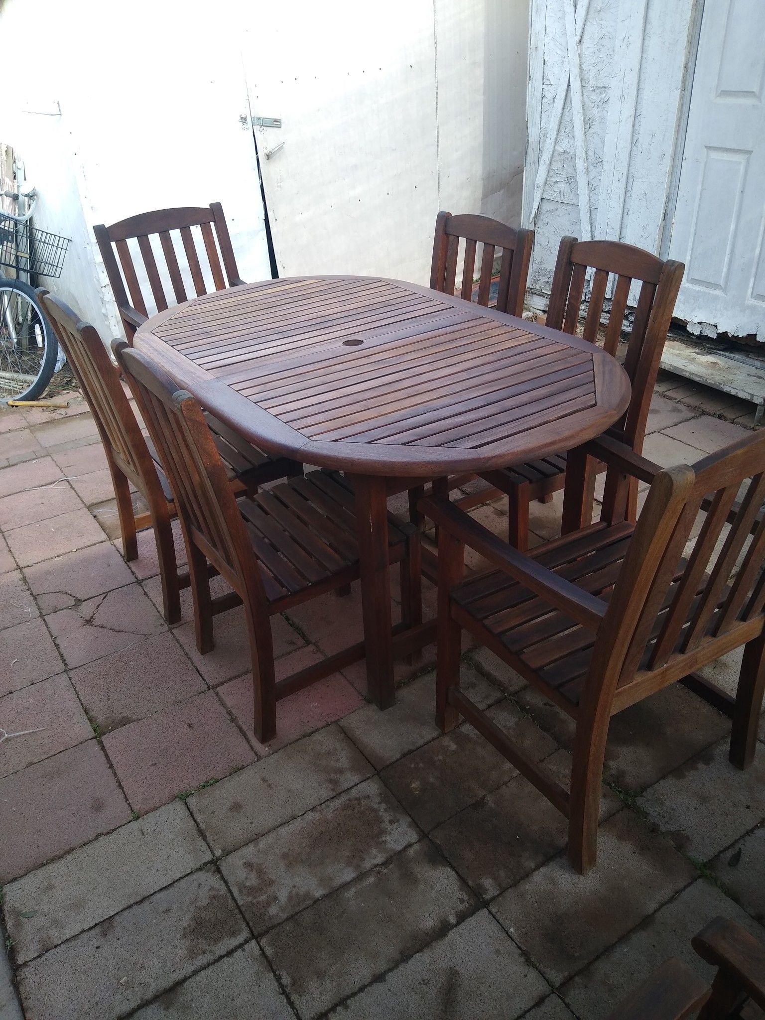 Teak wood dinette set and reclining chairs and trunk and rocking chair tables