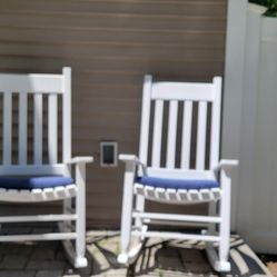 2 White Rocking Chairs With Navy Cushions