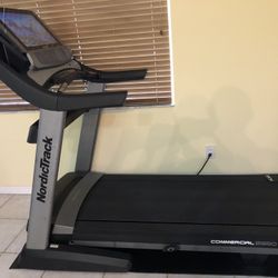 Stationary Schwinn IC4 Bike and Nordictrack Commercial Treadmill 2950