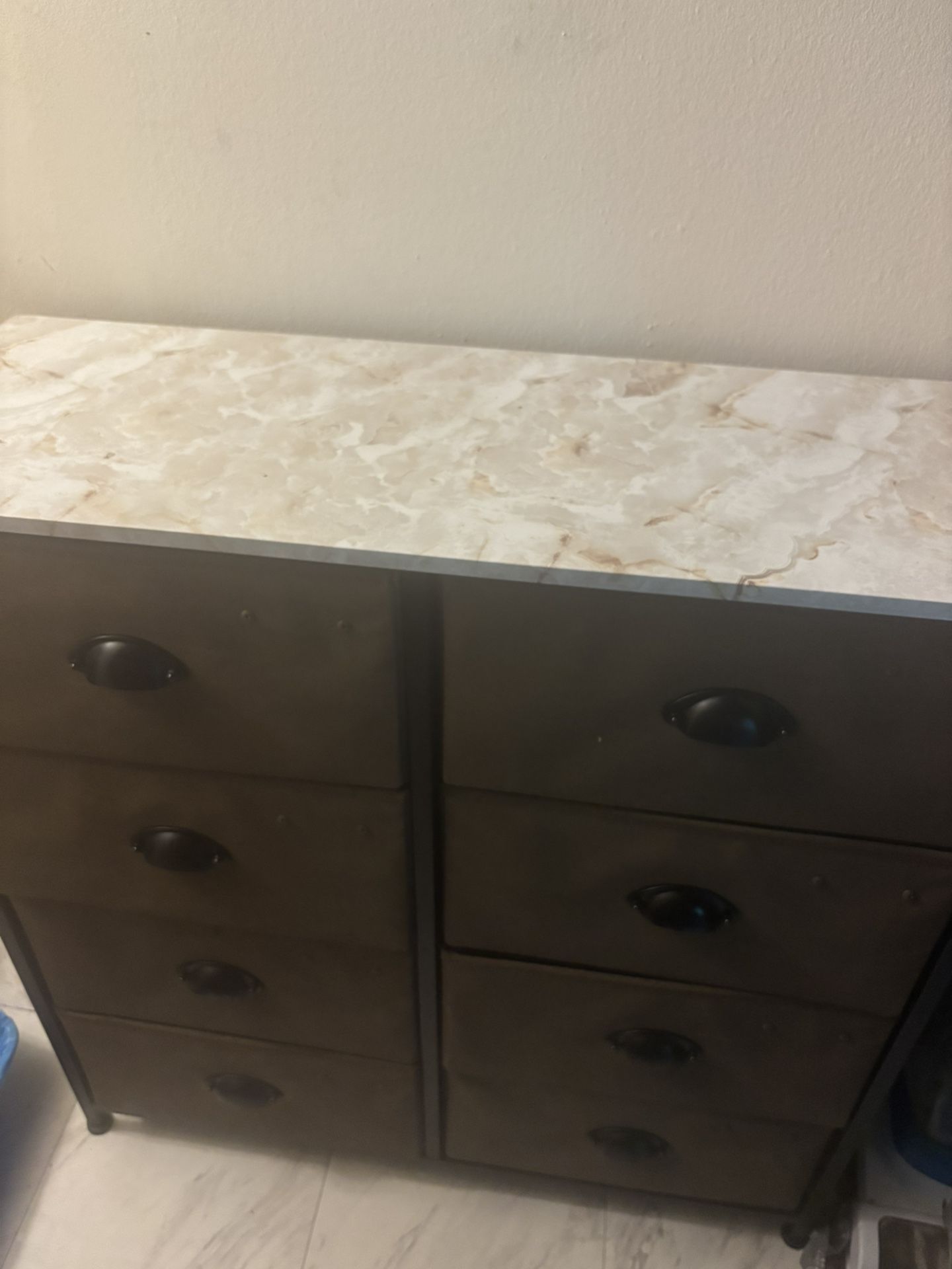 Dark Brown Drawers With Marble Countertops
