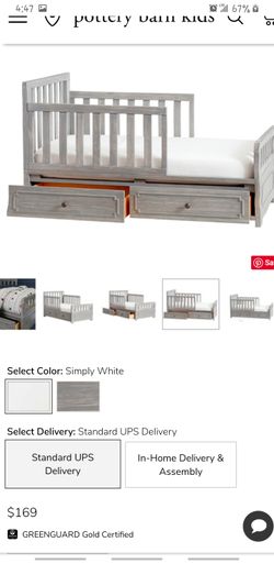 Gray Todler bed with matress