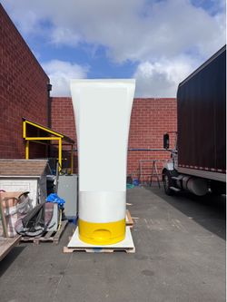 10’ tall Sunscreen bottles (x2)
