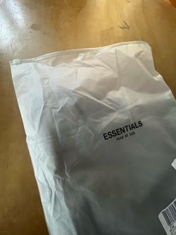 Grey essentials T-shirt with packaging