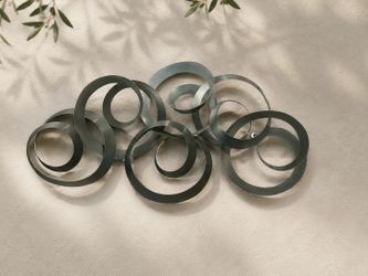 abstract metal ring wall sculpture