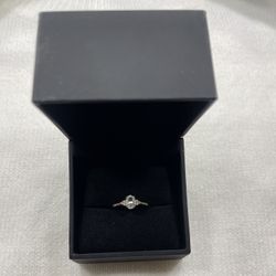 Oval White Lab-Created Sapphire and 1/10 CT. T.W. Diamond Ring in 10K Gold