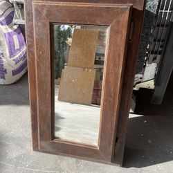 Wooden cabinet with mirror