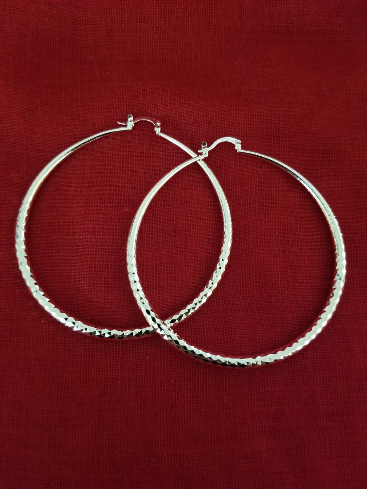 Large silver tone hoop earrings. (Pick Up Only)
