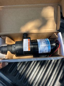 Discharge pump or macerator pump for holding tank waste