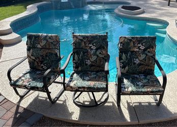 Set of 3 black metal patio chairs featuring high-back tropical leaf-patterned cushions.