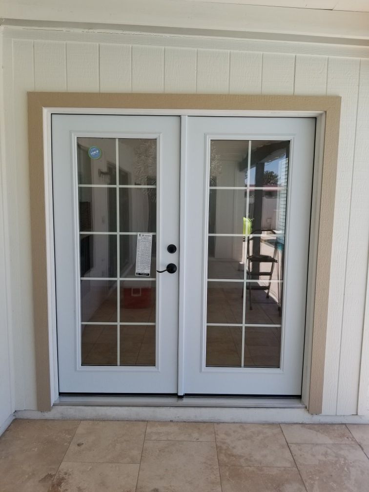 Masonite patio double French door with the grids inside of the glass