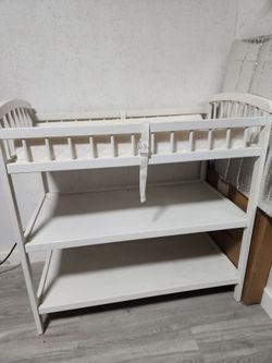 white wooden changing table