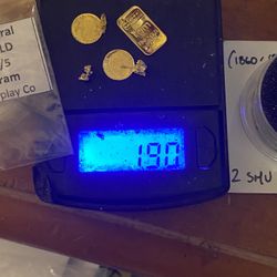A little over 2 g of pure gold bar and rounds and nuggets