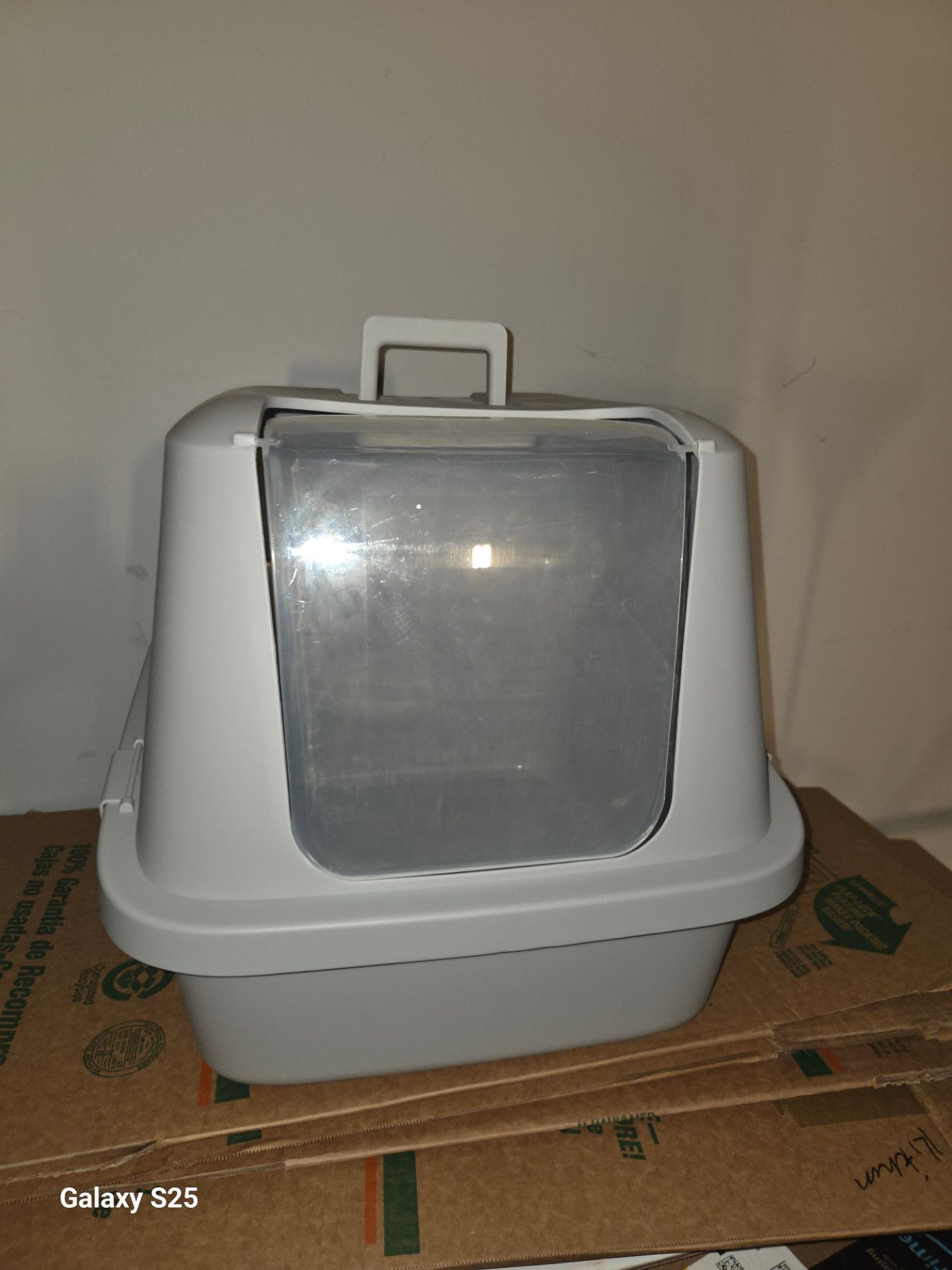 Van Ness gray enclosed cat litter pan with a swinging door.