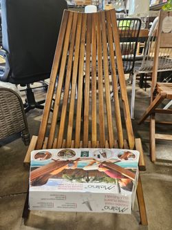 Melino Acacia Wood Folding Chair with a natural finish.