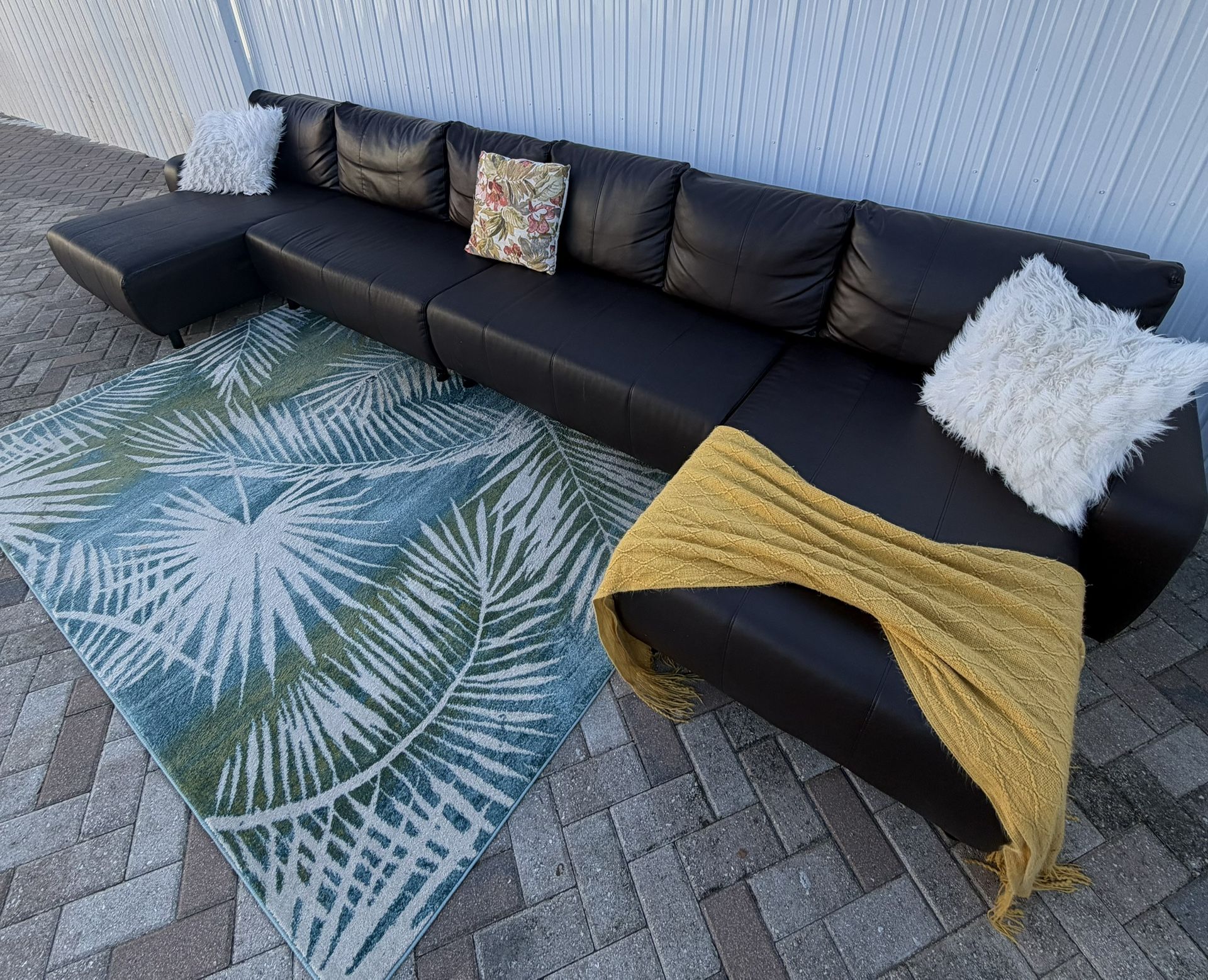 Leather sectional sofa from IKEA. Delivery available for an additional cost. (Very large) measures 170"x55". It’s very comfortable. Price $300 