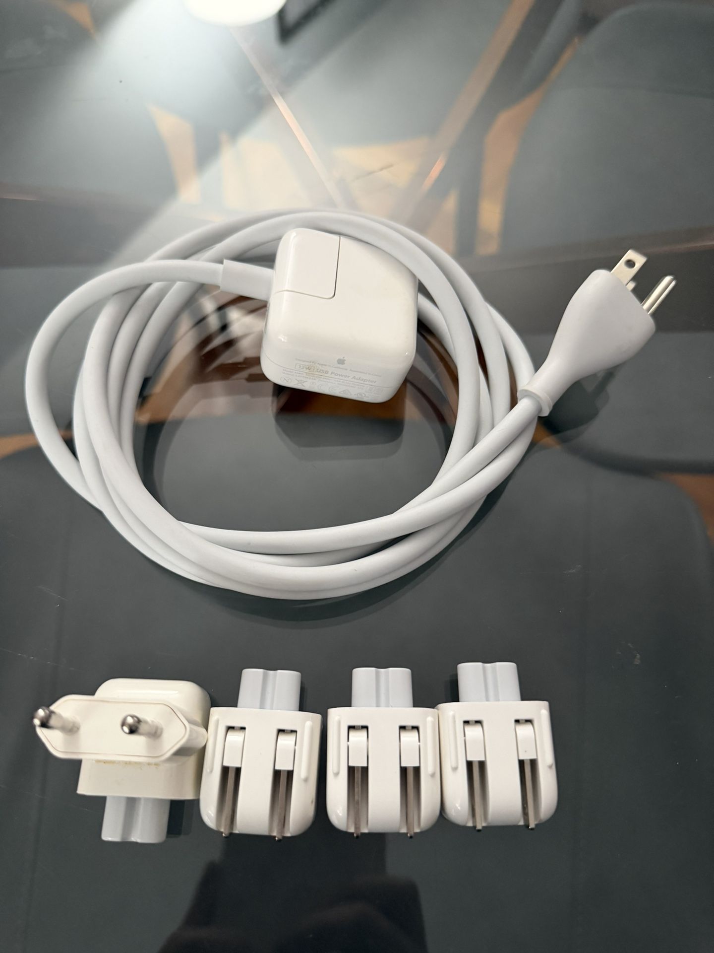 Apple power adapter with an extension cable and a set of international plug adapters