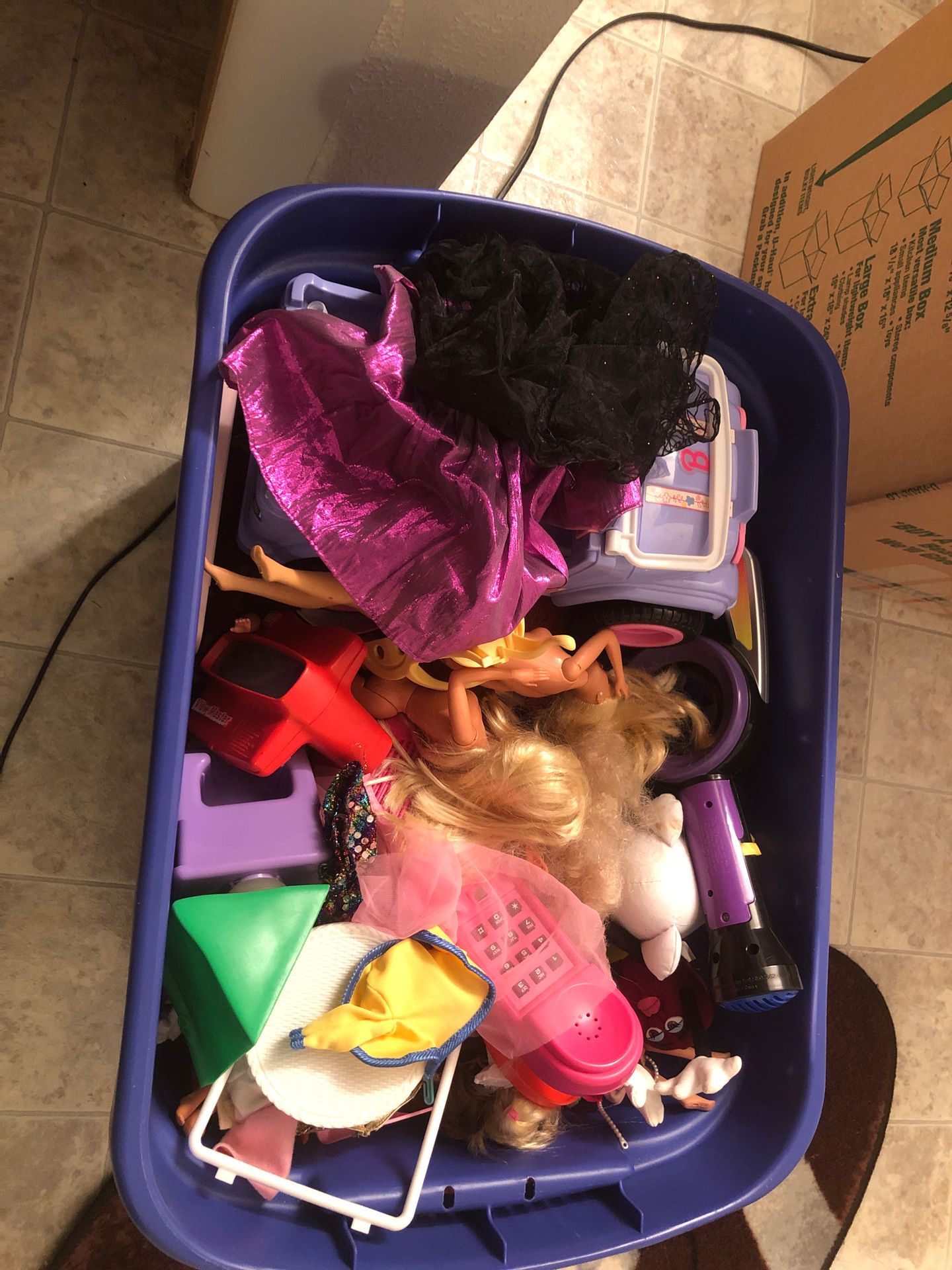 Bin full of vintage barbies and other assorted toys from the 80’s and early 90’s