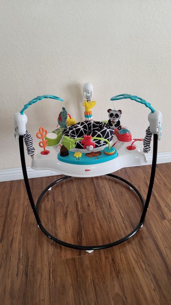 Practically New Fisher Price Baby Jumper With Music And Lights ( Used Once).